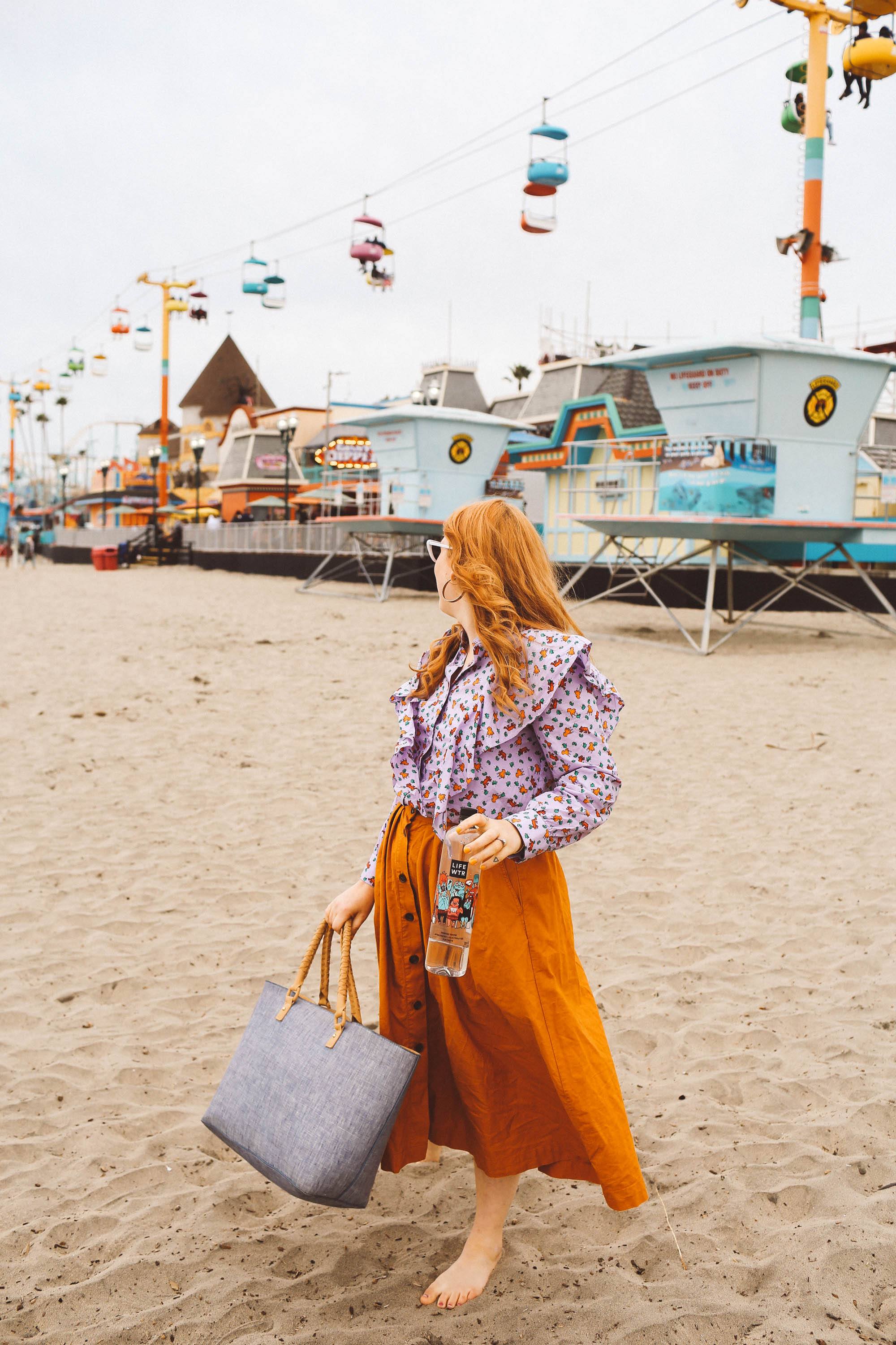 santa cruz boardwalk woman orange skirt beach